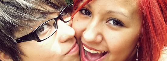 Two lesbians smiling