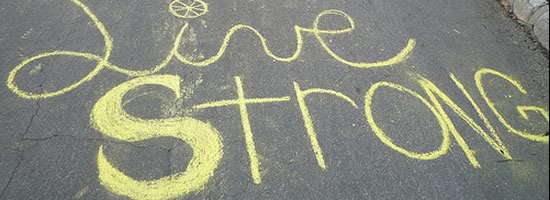 Living Strong on the footpath in chalk